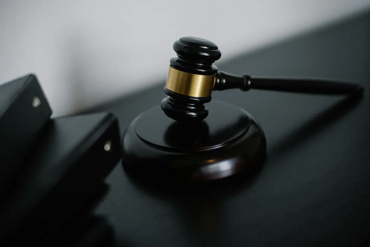 Gavel on a dark wooden desk