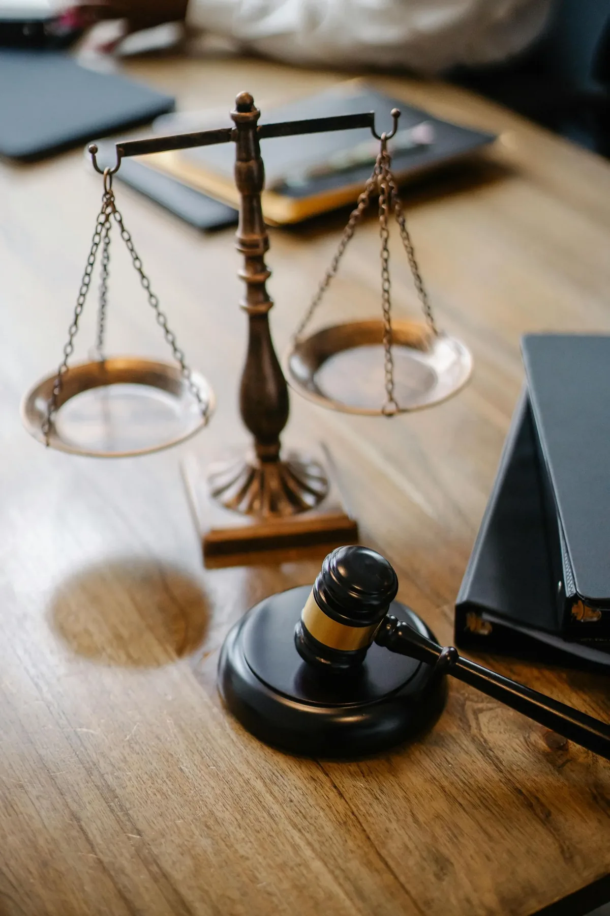 Scales of justice and gavel on a wooden desk